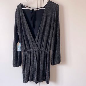 Black sparkly romper. Never worn, open back.
